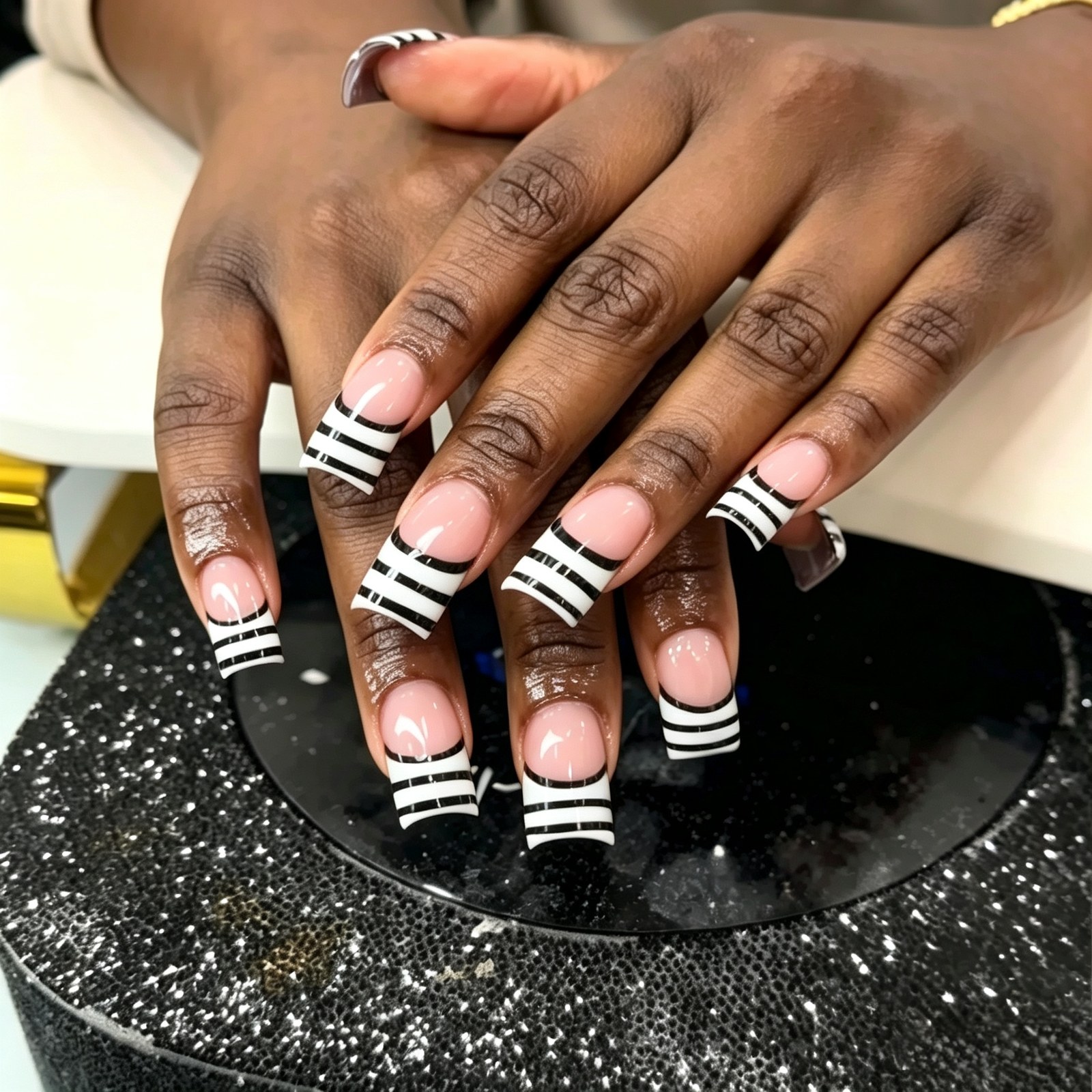 Black and white striped French tips